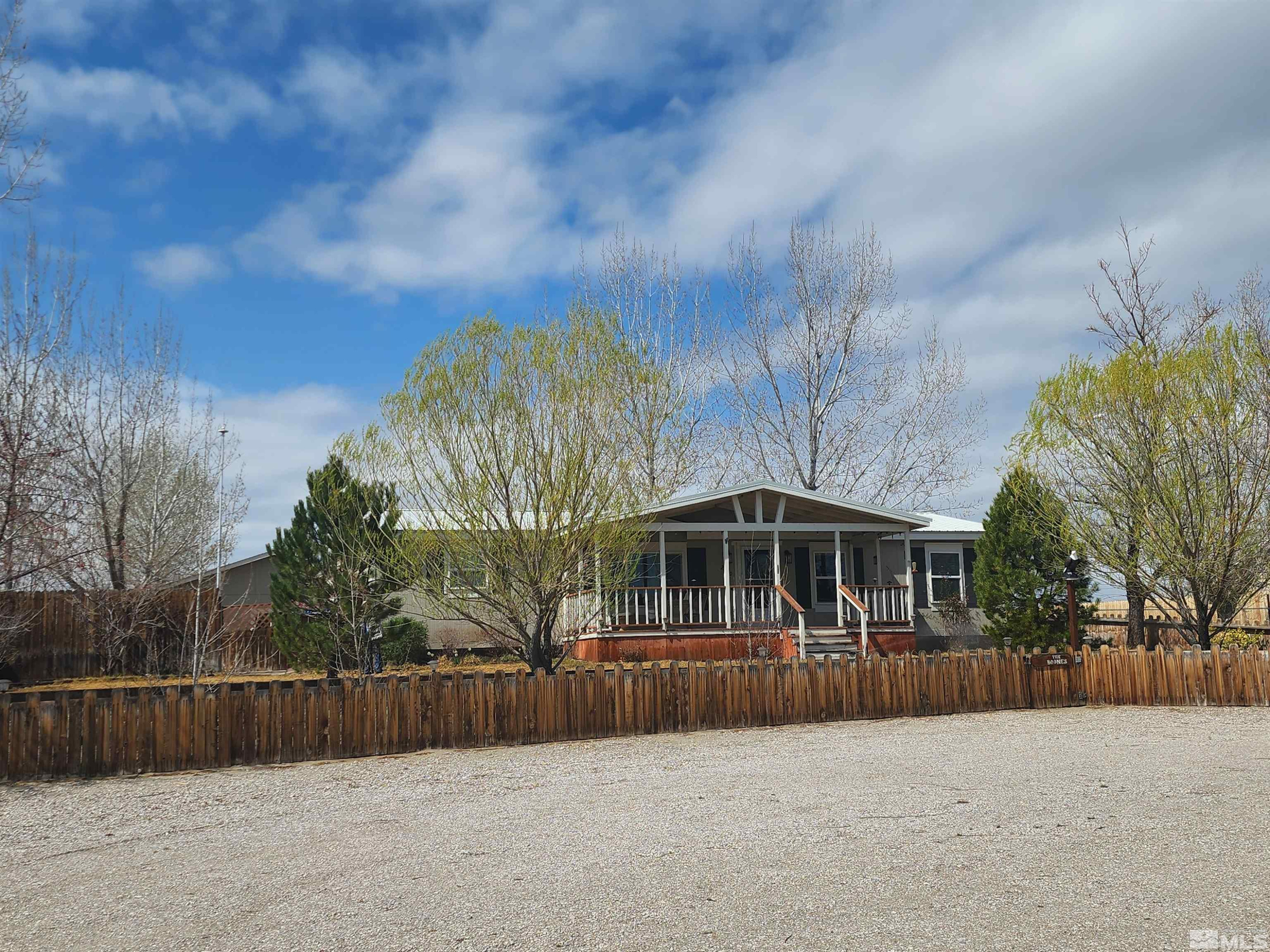 a swimming pool with outdoor seating and yard