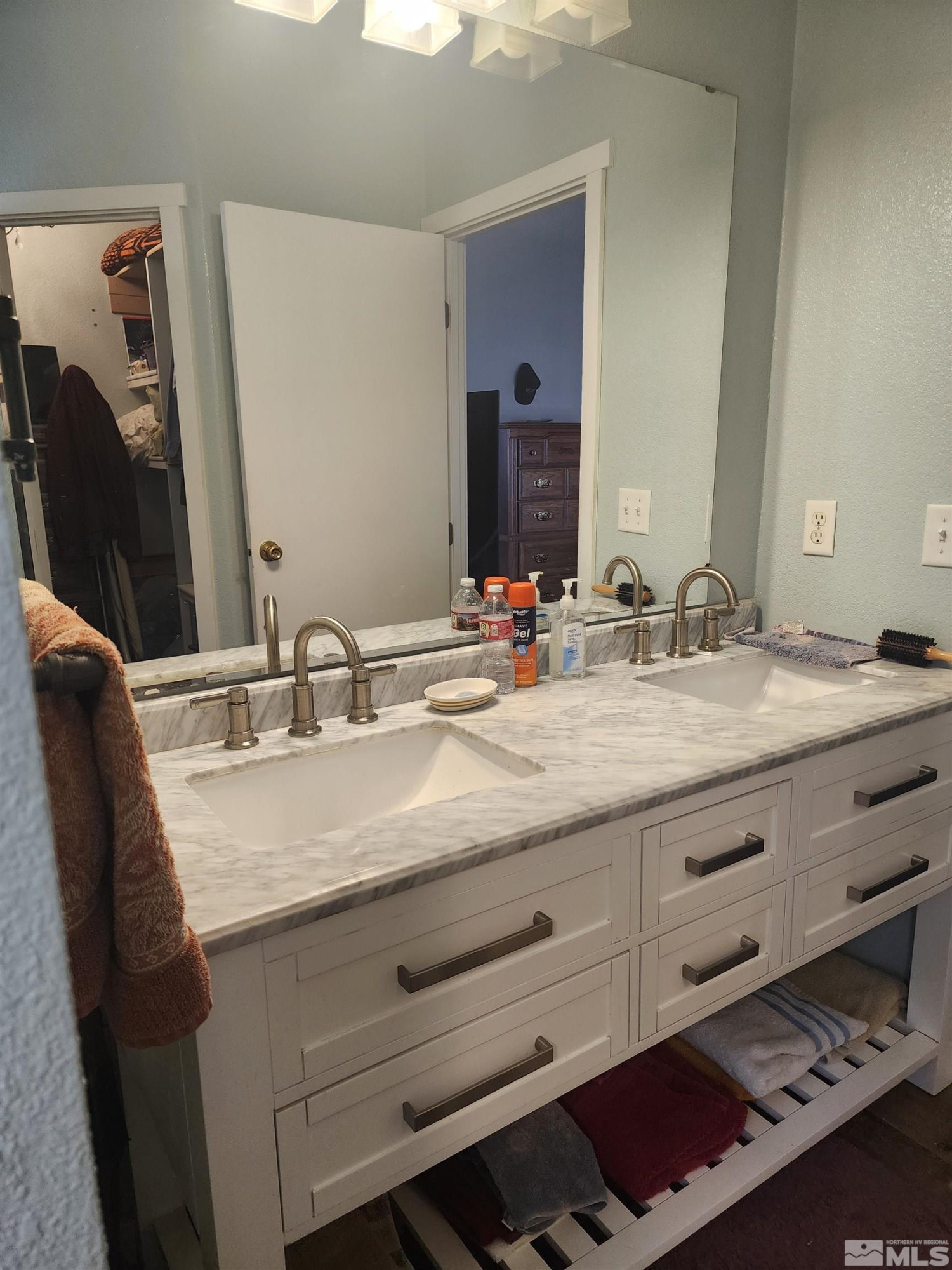 2650 Harvey Lane Fallon, NV 89406 - Photo 13 of 29 a bathroom with a granite countertop sink and a mirror