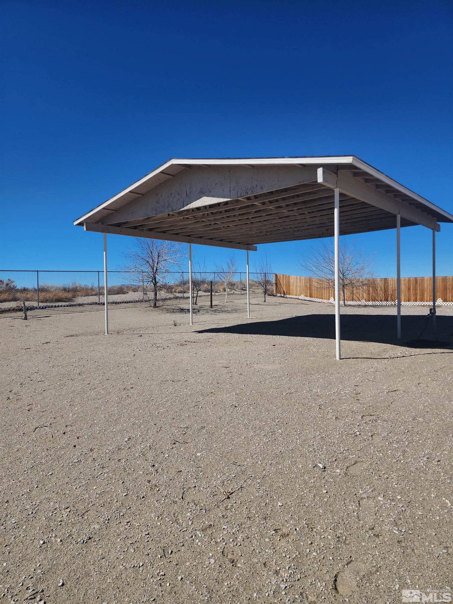 2650 Harvey Lane Fallon, NV 89406 - Photo 16 of 29 a backyard of a house with wooden fence