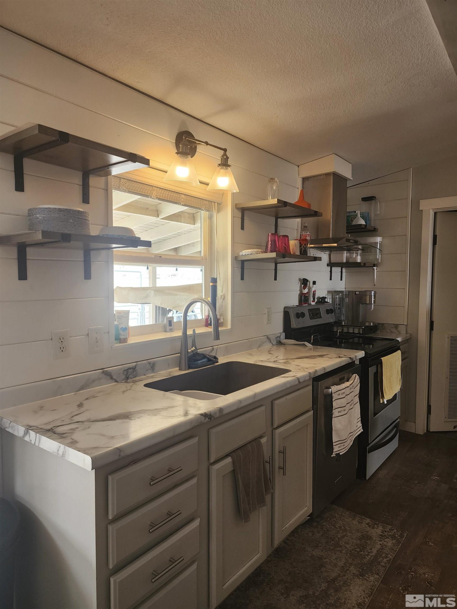 2650 Harvey Lane Fallon, NV 89406 - Photo 5 of 29 a kitchen with a sink cabinets and window