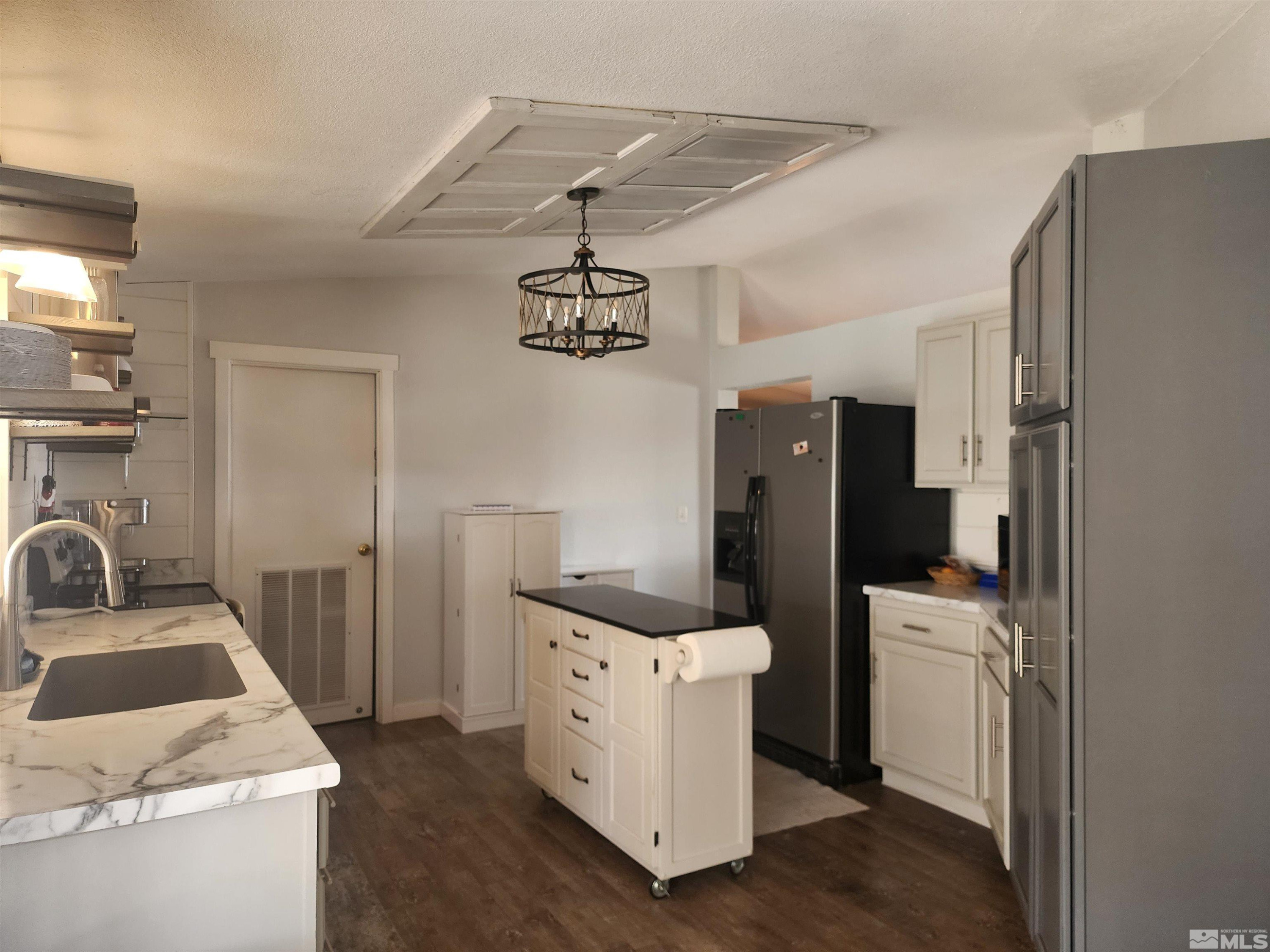 2650 Harvey Lane Fallon, NV 89406 - Photo 6 of 29 a kitchen with refrigerator and stove