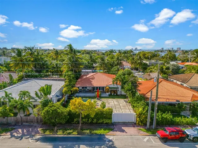 an aerial view of a house with a garden