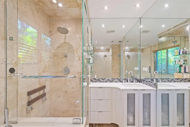 an aerial view of residential houses with outdoor space and swimming pool