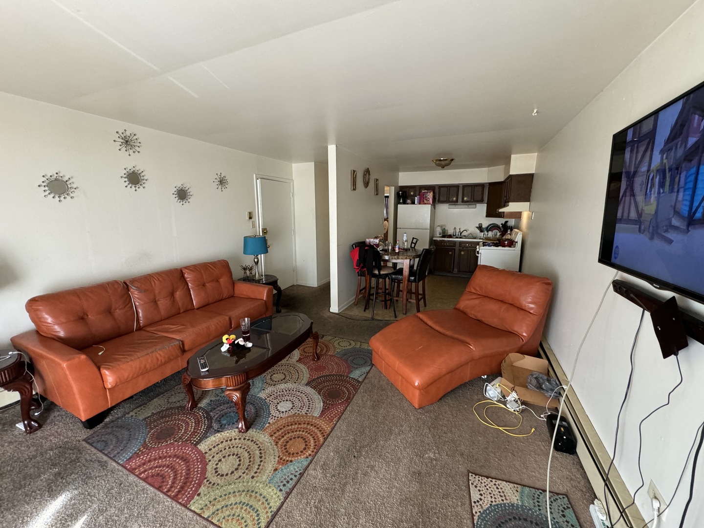 2936 Bernice Road Lansing, IL 60438 - Photo 20 of 28 a living room with furniture and a flat screen tv
