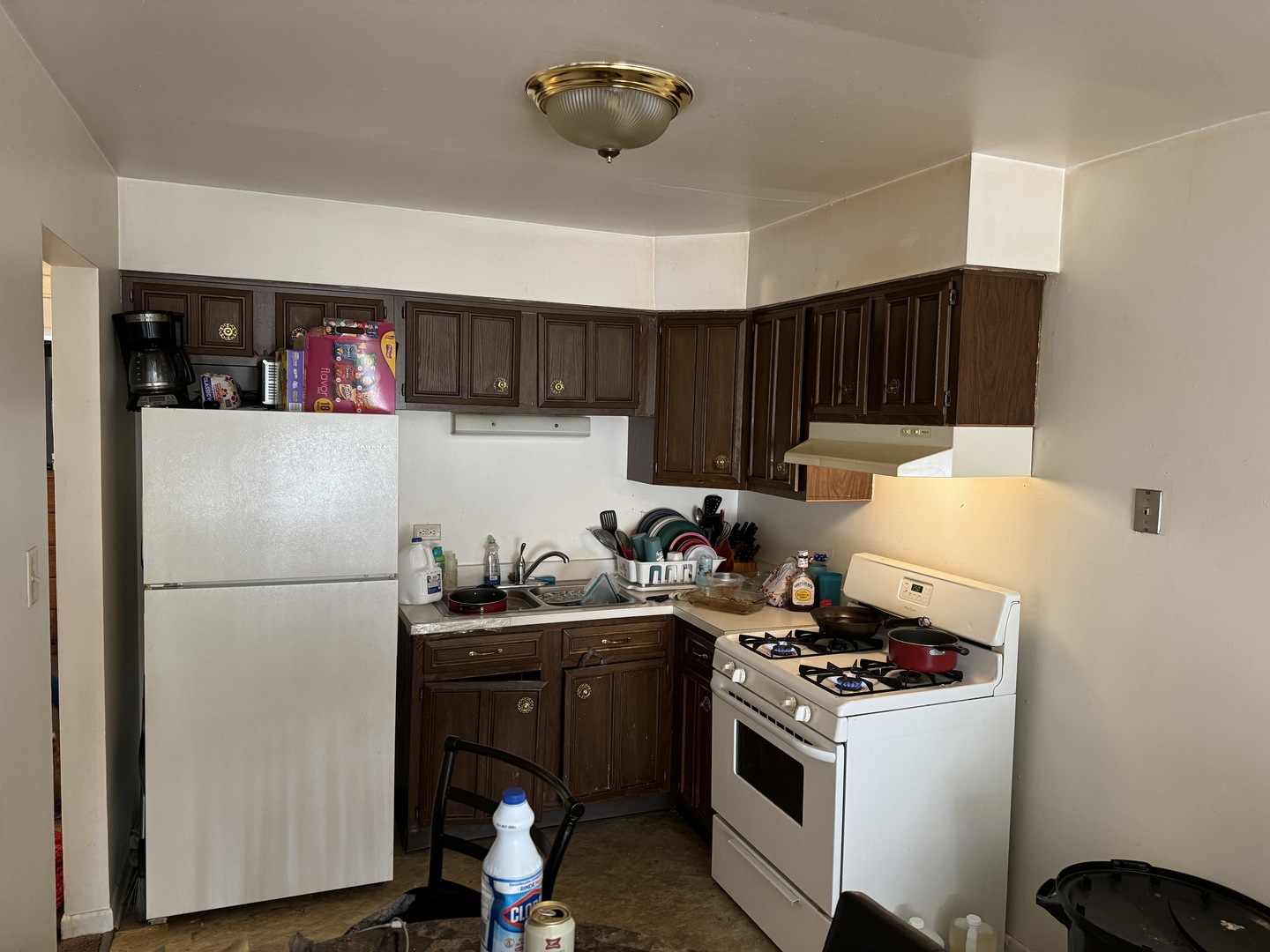 2936 Bernice Road Lansing, IL 60438 - Photo 22 of 28 a kitchen with a refrigerator and a stove top oven