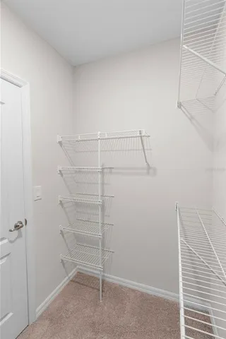 a view of a room with racks on the wall