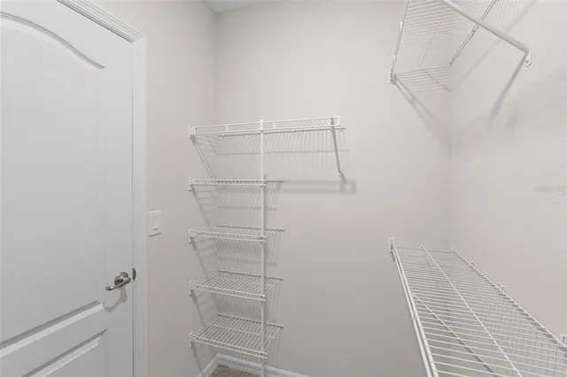 a view of a room with racks on the wall