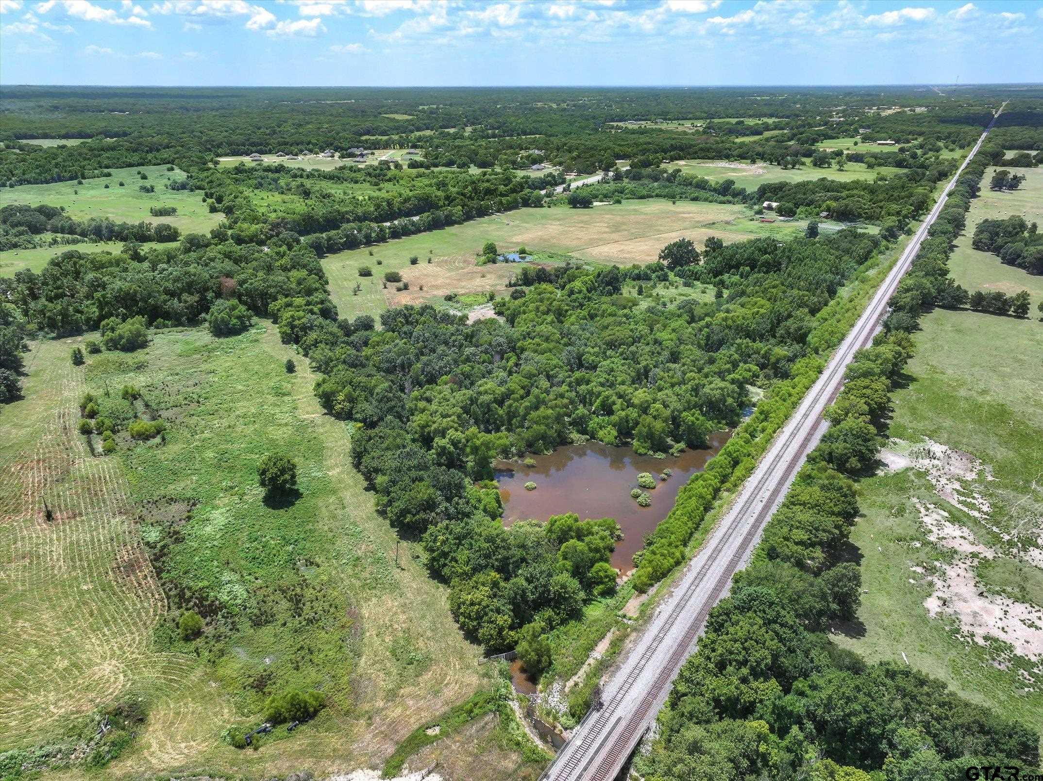 15542 Us Highway Edgewood, TX 75117 - Photo 14 of 23 an aerial view of residential houses with outdoor space and trees