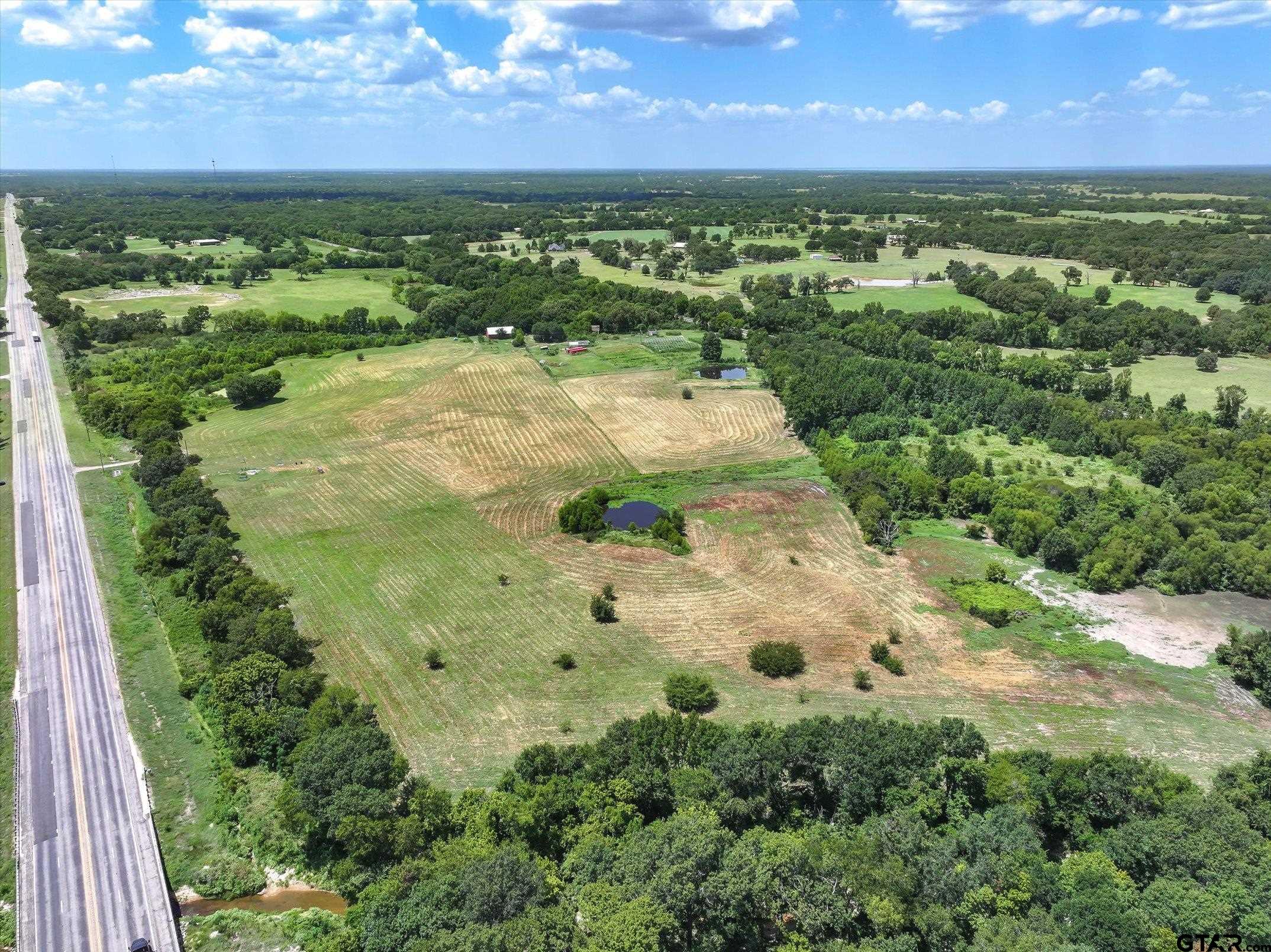 15542 Us Highway Edgewood, TX 75117 - Photo 22 of 23 a view of a lake with a houses