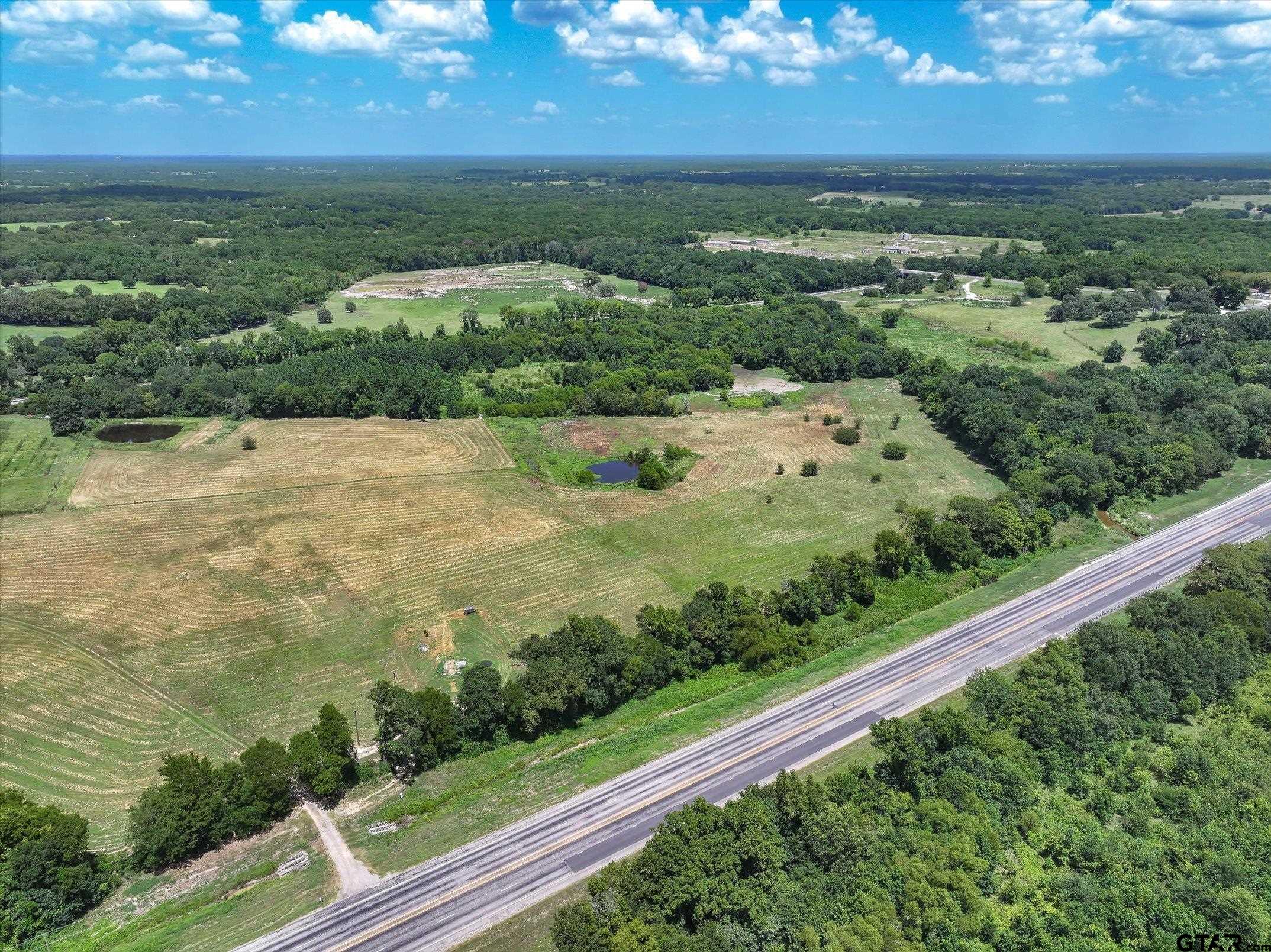 15542 Us Highway Edgewood, TX 75117 - Photo 3 of 23 a view of a yard with an ocean view