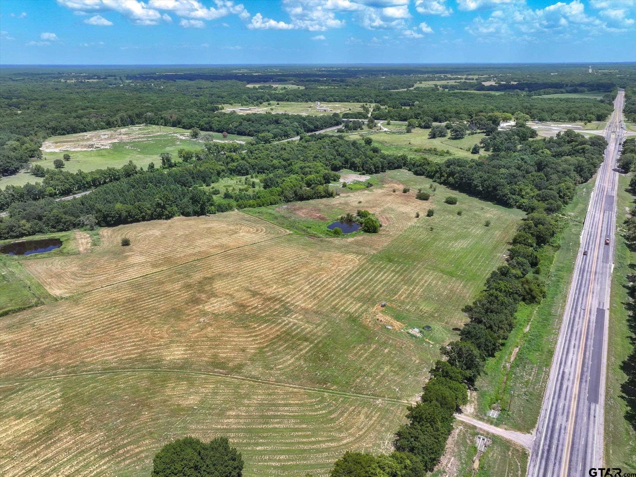 15542 Us Highway Edgewood, TX 75117 - Photo 4 of 23 an aerial view of residential houses with outdoor space and trees
