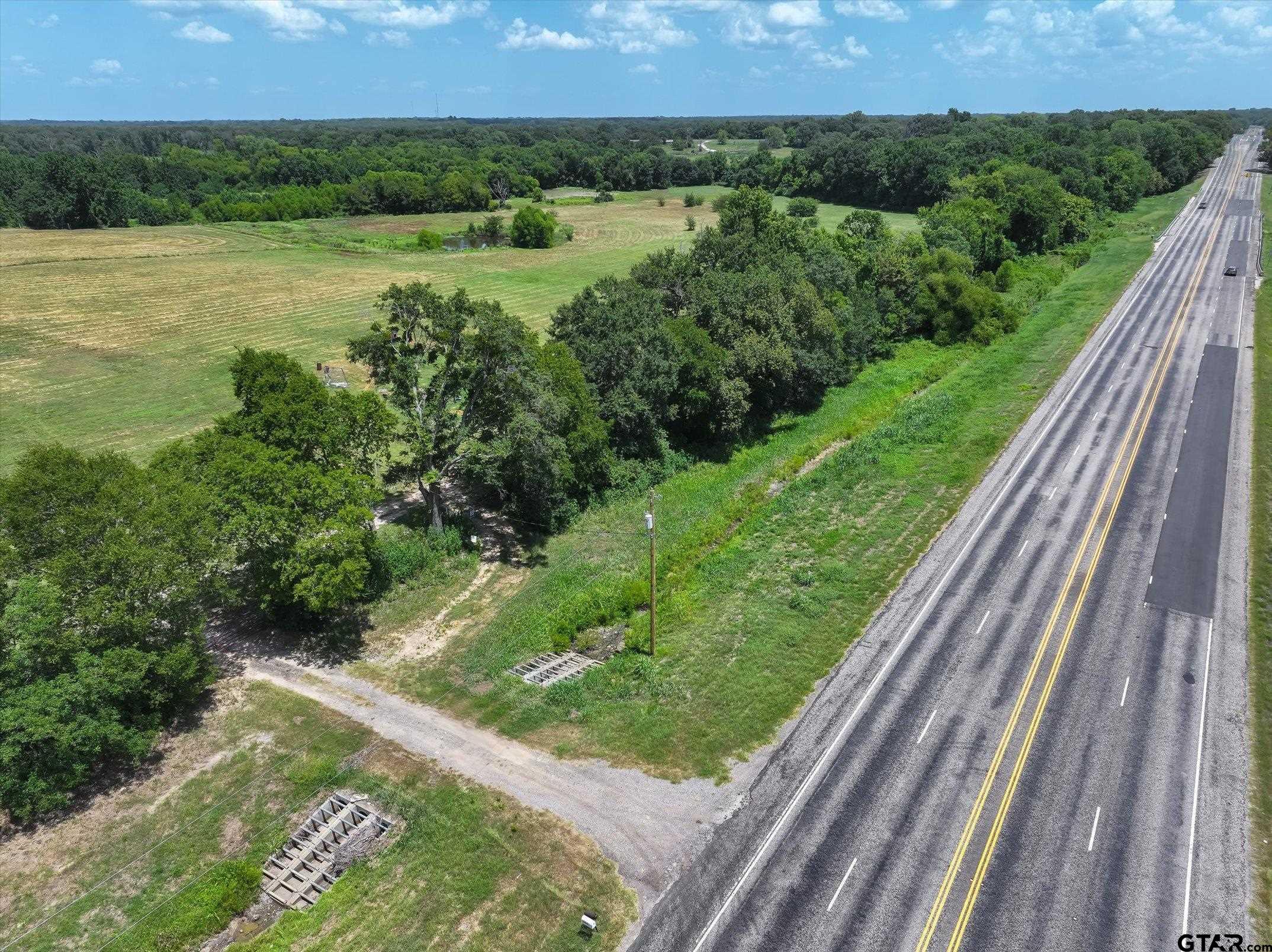 15542 Us Highway Edgewood, TX 75117 - Photo 5 of 23 a view of a lush green field