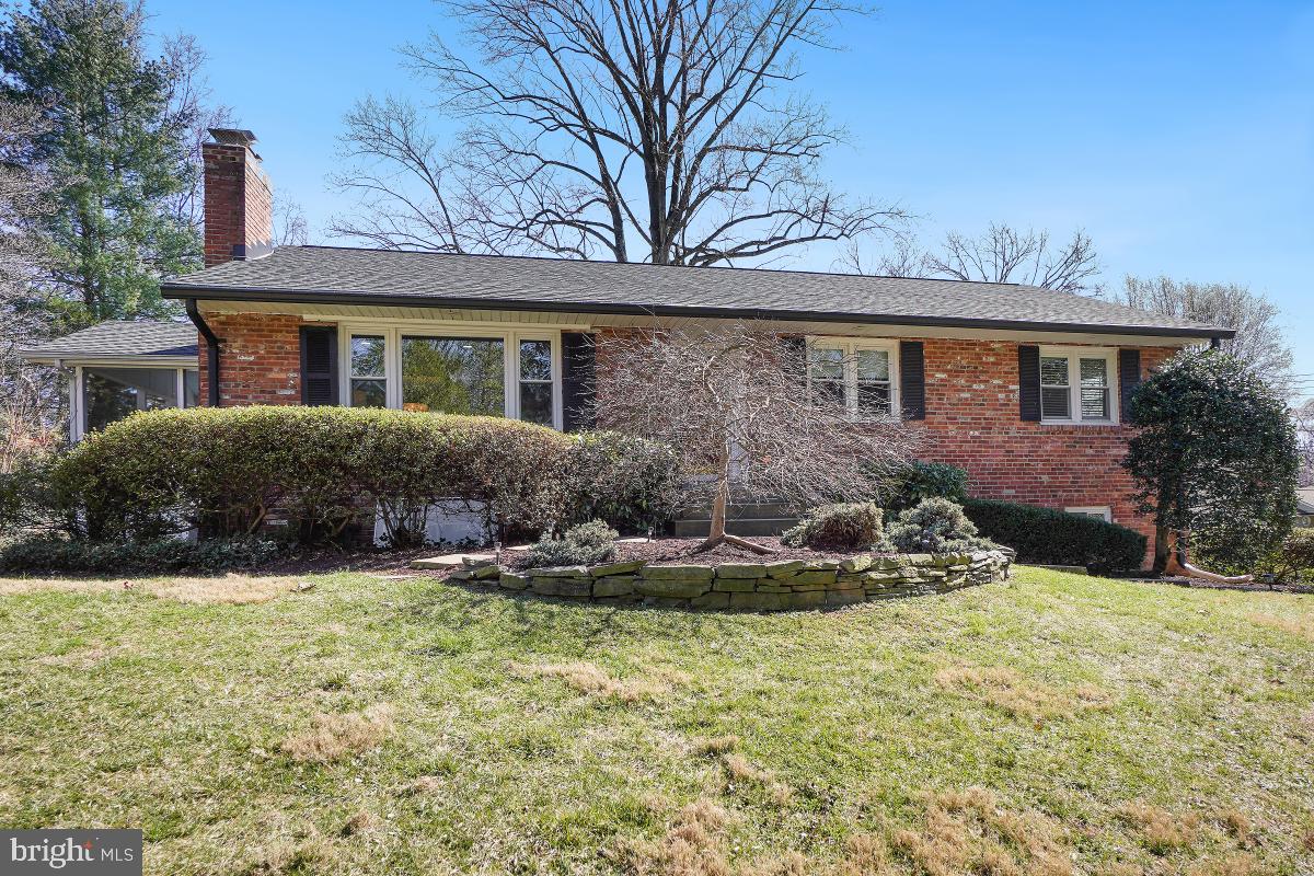 7343 Barbour Court Falls Church, VA 22043 - Photo 1 of 56 a front view of a house with a yard and garage