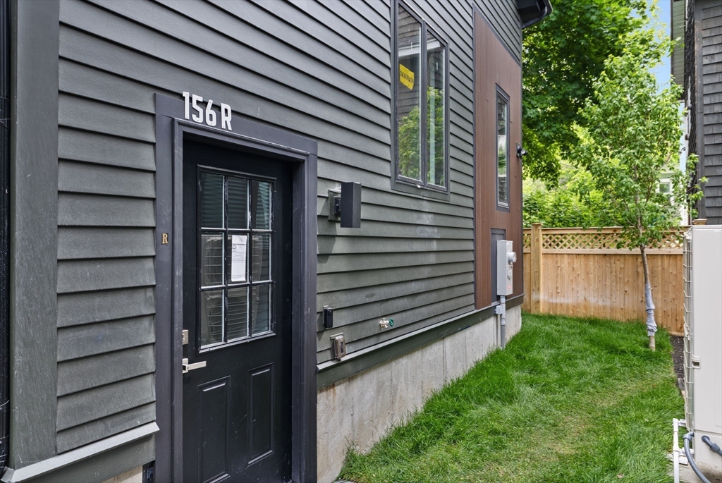 156 Albion Street, Unit R Somerville, MA 02144 - Photo 19 of 21 a view of a house with a large window