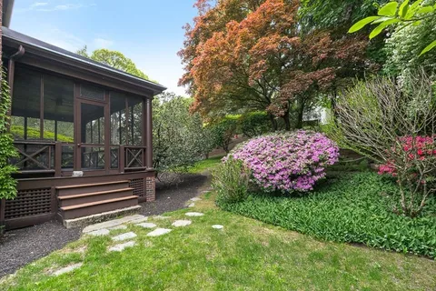a backyard of a house with lots of green space