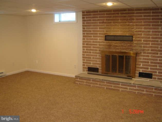 5019 Bushey Road Sykesville, MD 21784 - Photo 22 of 25 LL Family Room w/ wood burning FP