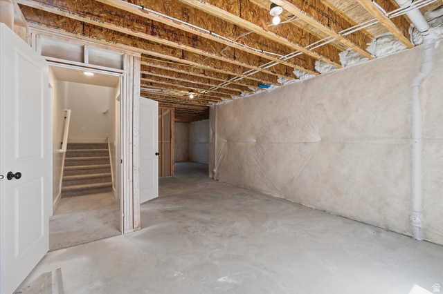 730 West 500 North Smithfield, UT 84335 - Photo 26 of 46 Unfinished basement space with exposed wood framing, concrete flooring, and insulated walls