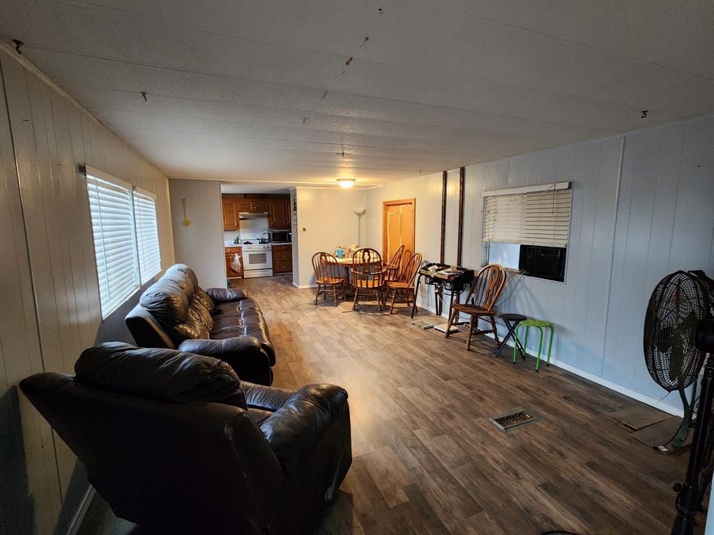 505 County Road 1442 Yantis, TX 75497 - Photo 11 of 19 a living room with furniture and a flat screen tv