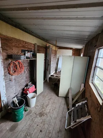 a room with window closet and furniture