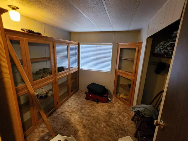 a bedroom with a bed and a cabinets