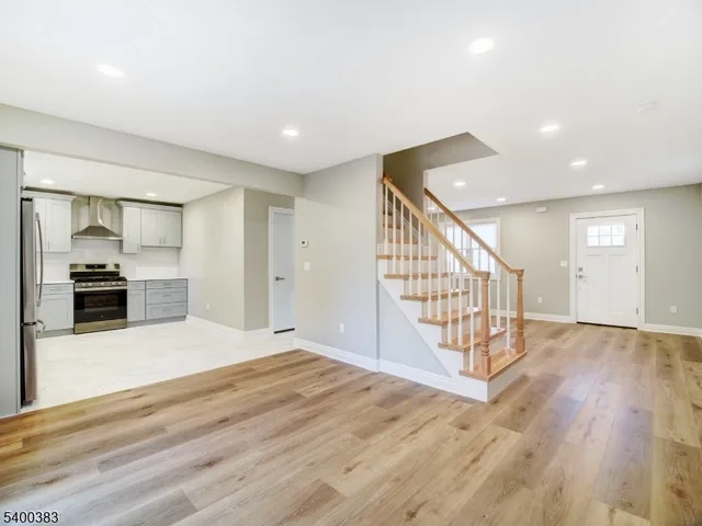 a kitchen with a refrigerator and a sink