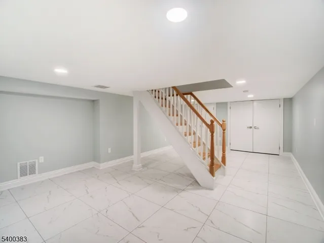 a utility room with sink dryer and washer