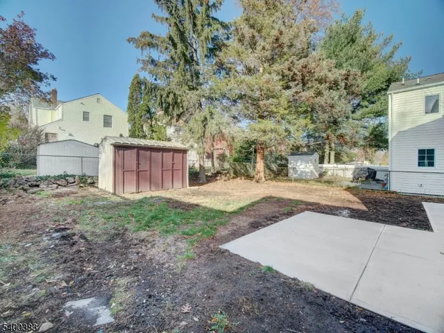 a view of a backyard of the house
