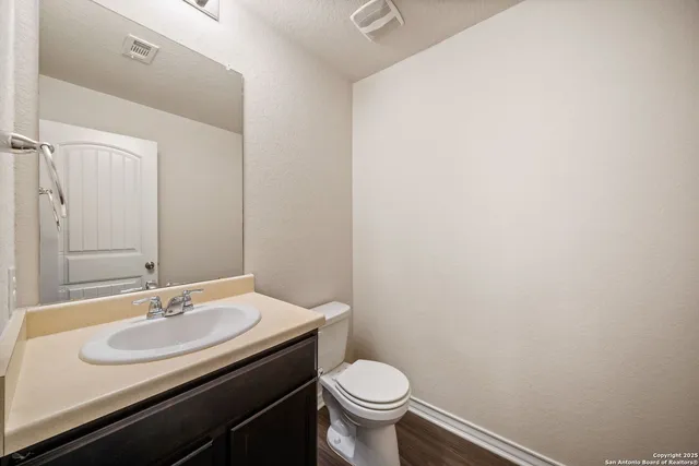 a bathroom with a sink and a toilet