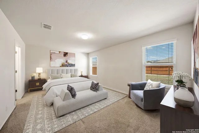 a bedroom with furniture and a couch