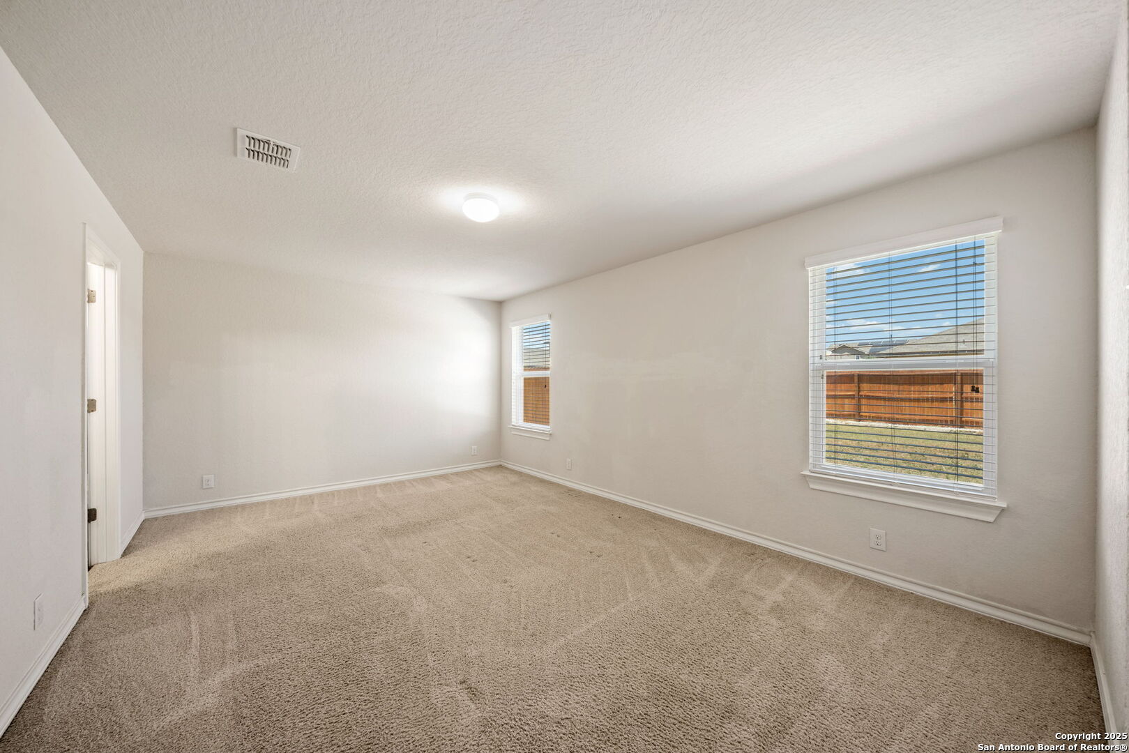 13415 Wild Rye San Antonio, TX 78254 - Photo 17 of 49 a view of an empty room with a window