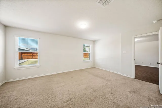 an empty room with windows