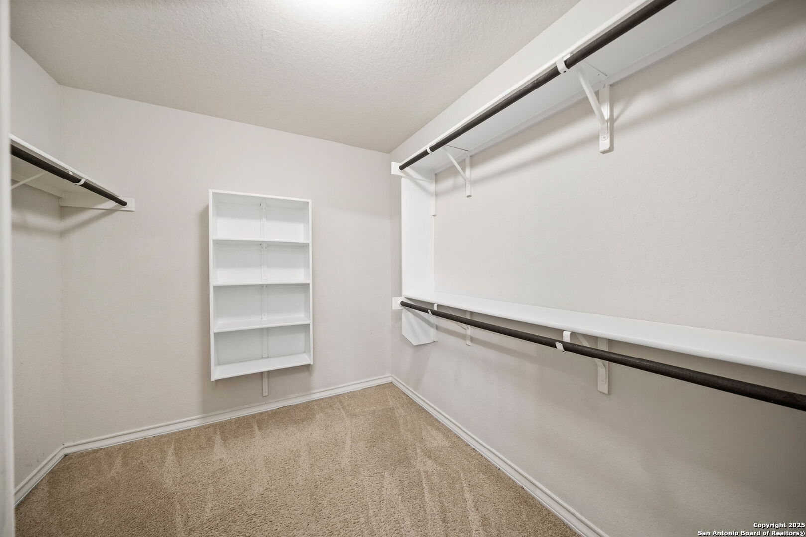 13415 Wild Rye San Antonio, TX 78254 - Photo 21 of 49 a view of walk in closet with empty racks
