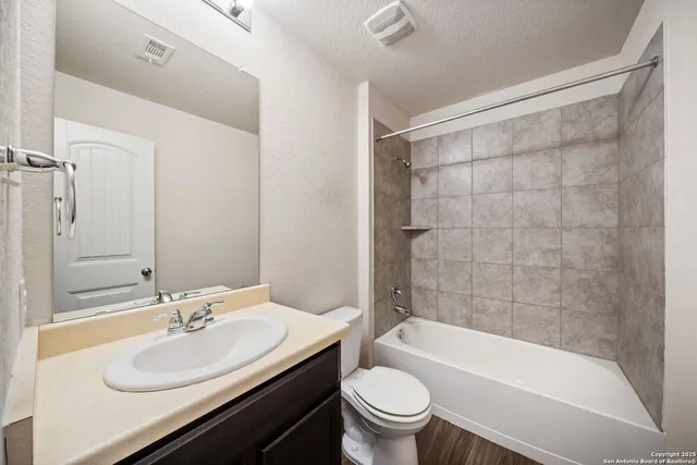 a bathroom with a sink a toilet and a bathtub