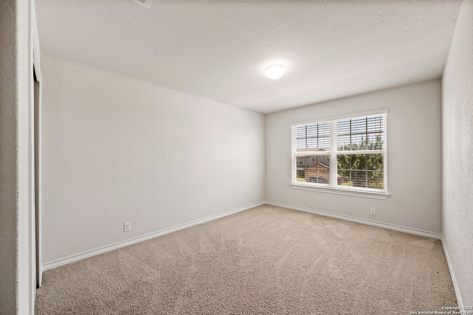 13415 Wild Rye San Antonio, TX 78254 - Photo 30 of 49 an empty room with a window