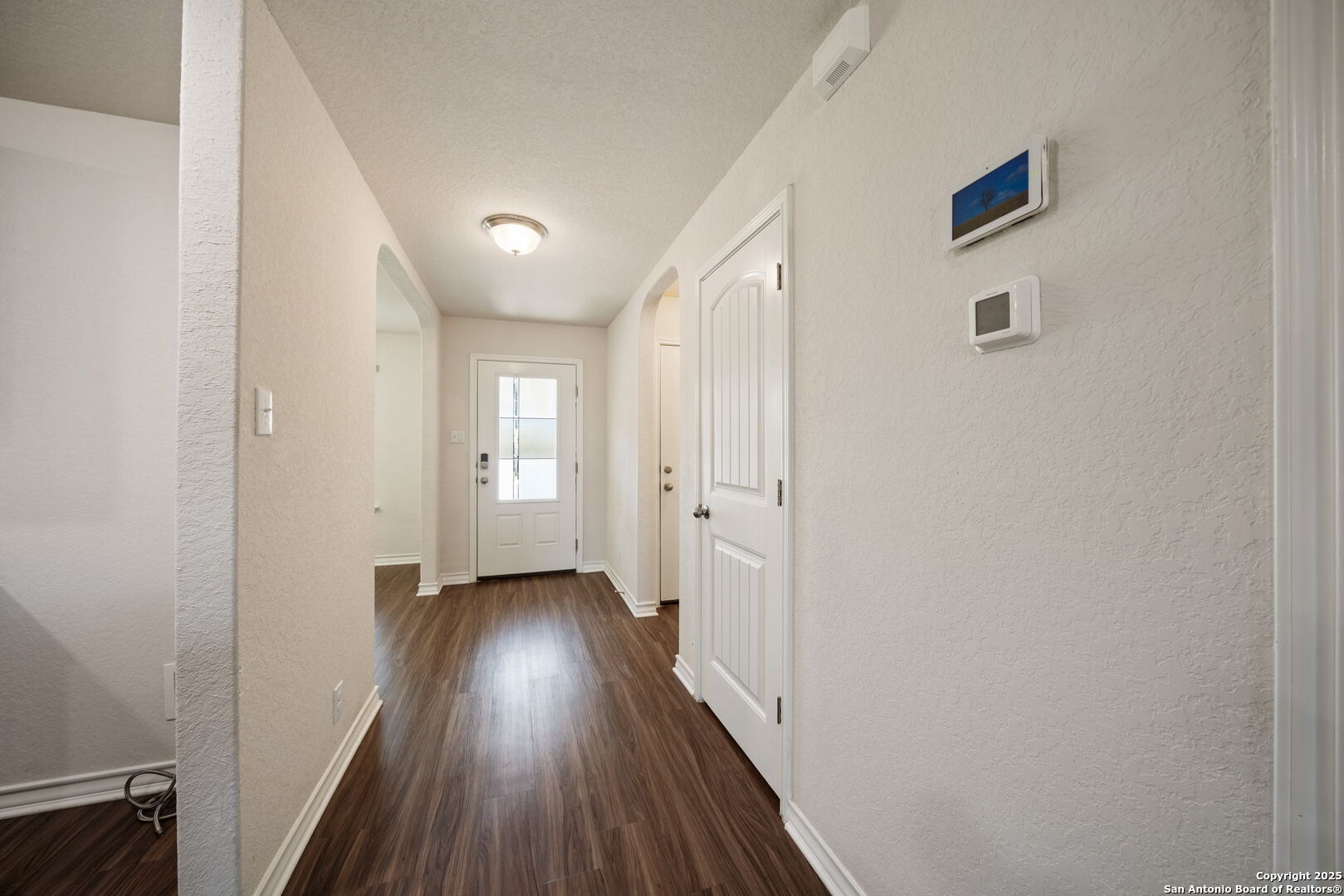 13415 Wild Rye San Antonio, TX 78254 - Photo 4 of 49 a view of a hallway with wooden floor