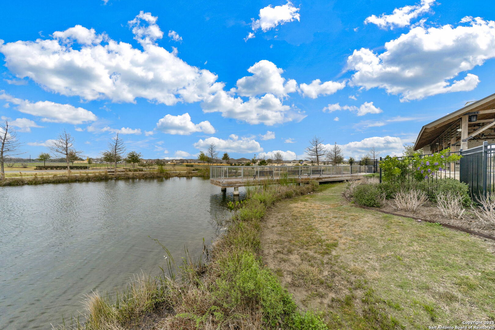 13415 Wild Rye San Antonio, TX 78254 - Photo 41 of 49 a view of a lake with a building in the background