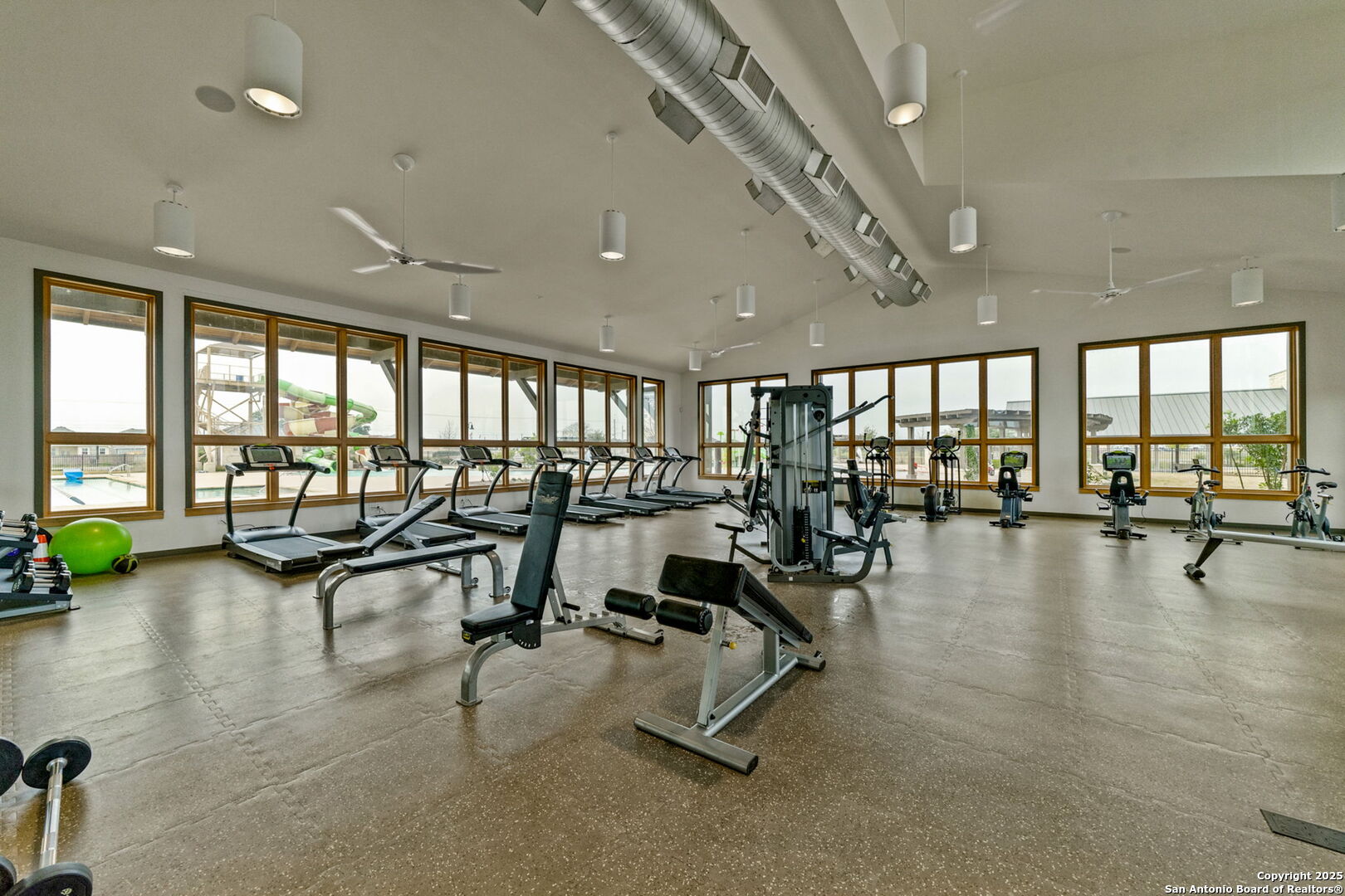 13415 Wild Rye San Antonio, TX 78254 - Photo 45 of 49 a view of a room with gym equipment and floor to ceiling window