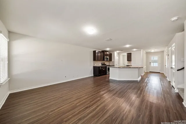 a view of kitchen with wooden floor