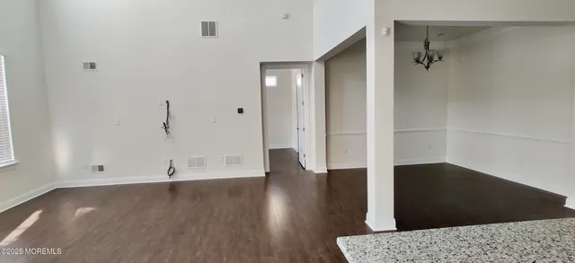 a living room with a couch and a window