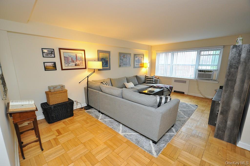 235 Garth Road, Unit A5B Scarsdale, NY 10583 - Photo 6 of 47 a living room with furniture and a window