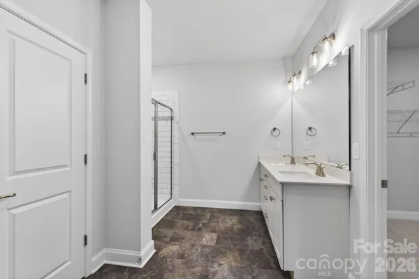 a bathroom with a sink and mirror