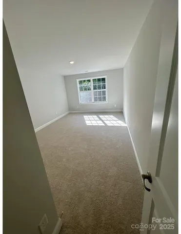 a view of a big room with windows