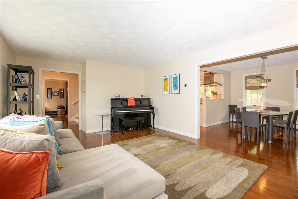 25 Ellen Road Stoneham, MA 02180 - Photo 12 of 41 a living room with furniture and a dining table with kitchen view