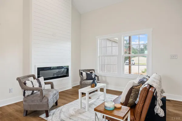 a living room with furniture fireplace and a flat screen tv