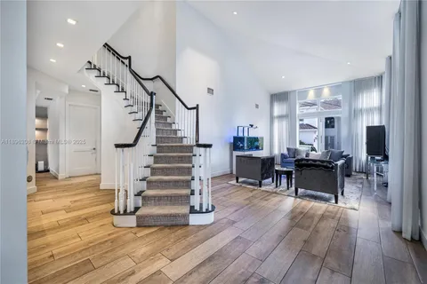 a bedroom with a bed window and dresser