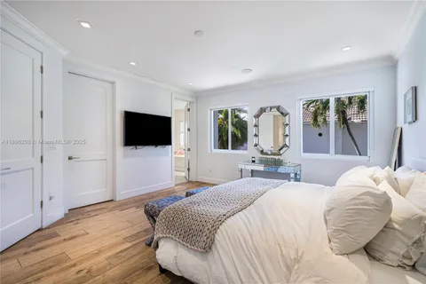 a spacious bathroom with a double vanity sink a mirror and a bathtub
