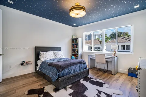a bathroom with a granite countertop sink toilet mirror and shower