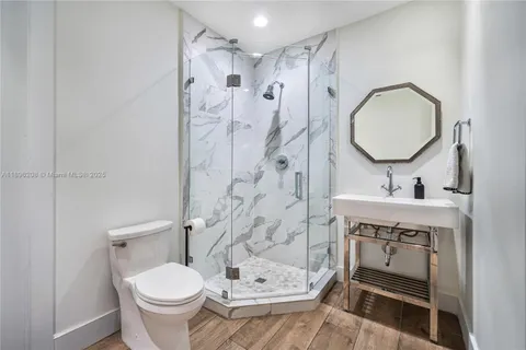 a view of a backyard with a patio and a garden