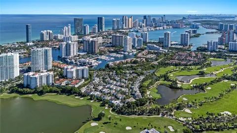 a view of a chairs and table in a backyard