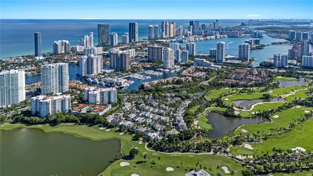 a view of a chairs and table in a backyard